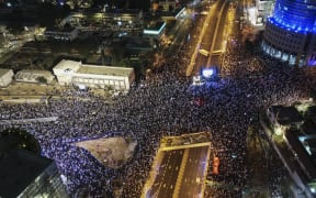 An aerial picture shows a protest against the Israeli government's controversial judicial reform bill in Tel Aviv on 11 March,  2023.