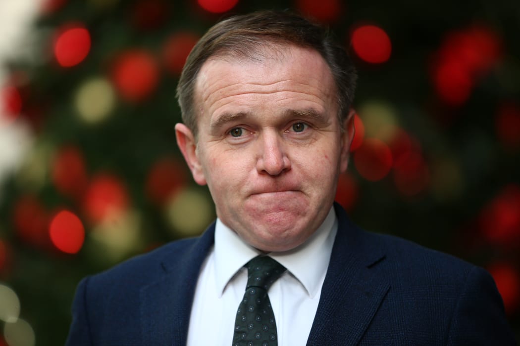 Britain's Environment Secretary George Eustice leaves Broadcasting House after making an appearance on the BBC political programme The Andrew Marr Show in London.