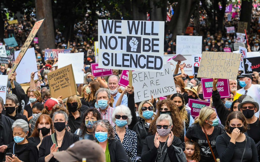 People attend a protest against sexual violence and gender inequality in Melbourne on March 15, 2021.