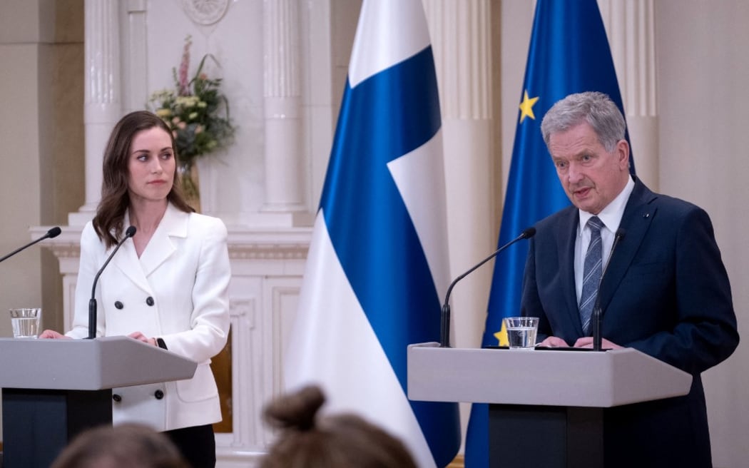 Finland's Prime Minister Sanna Marin (L) and Finland's President Sauli Niinistö give a press conference to announce that Finland will apply for NATO membership at the Presidential Palace in Helsinki, Finland on May 15, 2022. - "Today, the President of the Republic and the Government's Foreign Policy Committee have jointly agreed that Finland will apply for NATO membership, after consulting parliament. This is a historic day. A new era is opening", President Sauli Niinisto said. As the next step, the Finnish parliament will convene on Monday, May 16, 2022 to debate the decision, with current projections showing a large majority of the country’s 200 member parliament supporting the bid. (Photo by Alessandro RAMPAZZO / AFP)