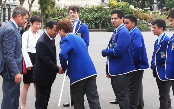 Chen Xiwen being welcomed to Parliament by St Patrick's College kapa haka group.