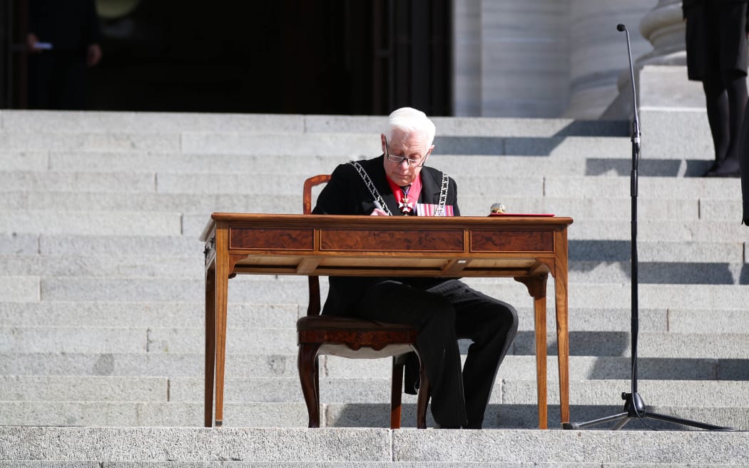 New Zealand Herald of Arms Extraordinary to the Queen Phillip O'Shea signs the proclamation dissolving the 51st Parliament.