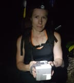 Deidre Vercoe, from the Kākāpō Recovery Programme, carries a precious kākāpō egg, in a small padded box, down to the 'egg room.'