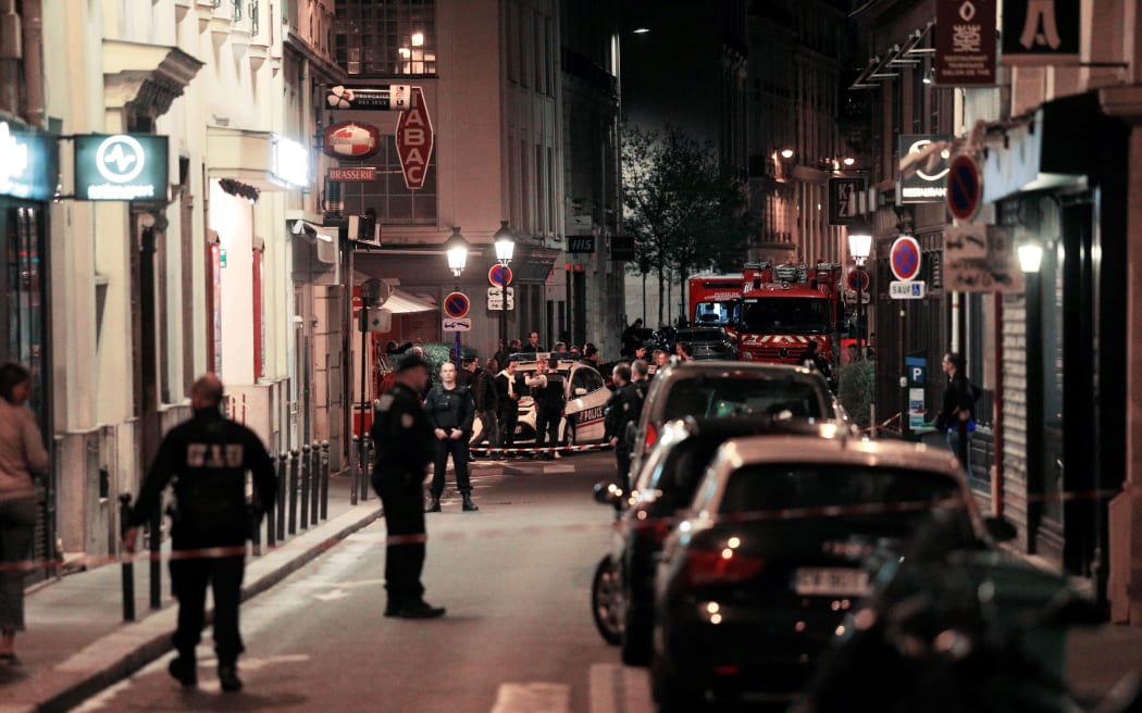Policemen stand guard in Paris after one person was killed and several injured.