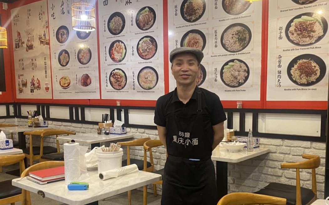 Mr. Yin, who runs two restaurants at "唐人汇"