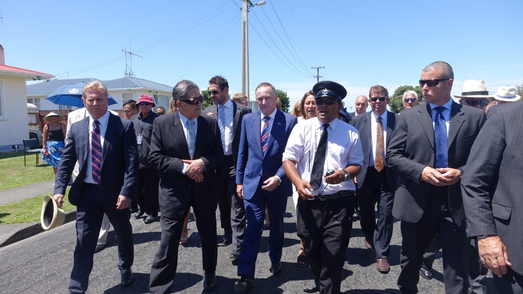 John Key (centre) making his way to the powhiri.