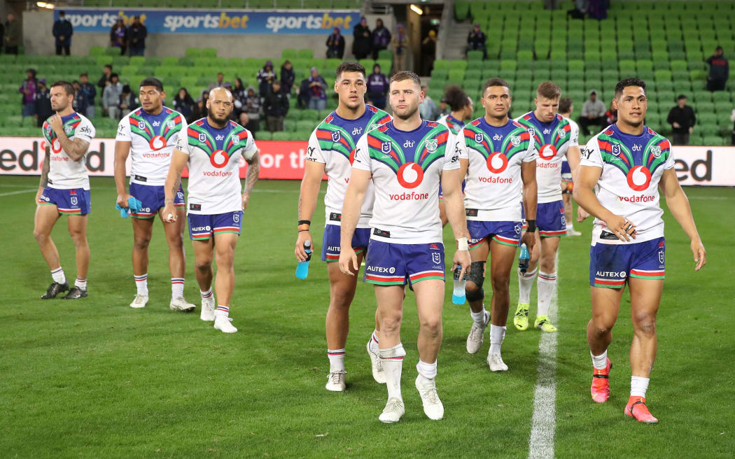 Warriors players look dejected after the round seven Anzac Day NRL match against the Melbourne Storm at AAMI Park on Sunday April 25, 2021 in Melbourne, Australia.