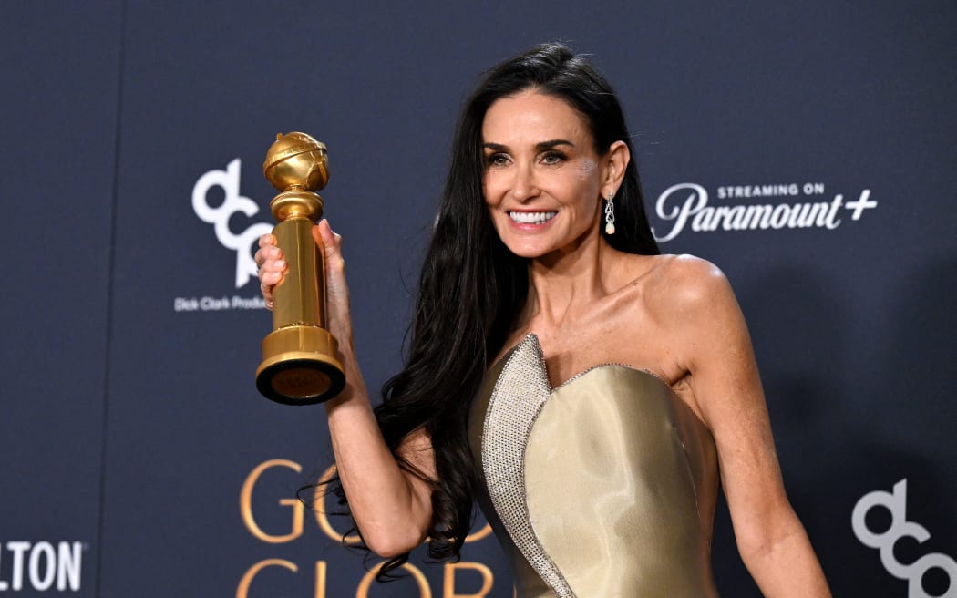 US actress Demi Moore poses with the Best Performance by a Female Actor in a Motion Picture – Musical or Comedy award for "The Substance" in the press room during the 82nd annual Golden Globe Awards at the Beverly Hilton hotel in Beverly Hills, California, on January 5, 2025.