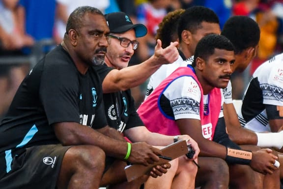 Fiji coach Ben Gollings (2L) gestures during the HSBC Rugby Sevens semi-final cup match between Fiji and New Zealand in Singapore on April 9, 2023. (Photo by Roslan RAHMAN / AFP)