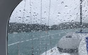 Alison and Graeme Leigh's vessel Running Free rides out the storm in Assassination Cove