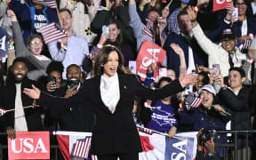 US Vice President and Democratic presidential candidate Kamala Harris gestures as she arrives to speak on The Ellipse just south of the White House in Washington, DC, on October 29, 2024. - The Harris-Walz campaign is billing the speech as "a major closing argument" one week before the November 5 election. (Photo by Brendan SMIALOWSKI / AFP)