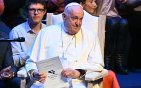 Pope Francis attends a meeting with students and members of the Catholic University of Louvain at the Aula Magna in Louvain-la-Neuve on September 28, 2024. The pope is on a four-day apostolic journey to Luxembourg and Belgium. (Photo by Alberto PIZZOLI / AFP)