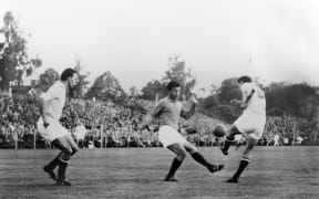 French player Just Fontaine (C) playing against Yugoslavia at the 1958 FIFA World Cup in Sweden.
