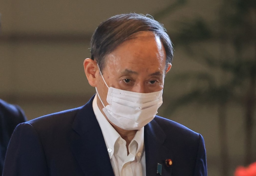 Japan's Prime Minister Yoshihide Suga arrives at Prime Minister's Office in Tokyo on Sep.9, 2021, amid continuing worries over the new coronavirus COVID-19. ( The Yomiuri Shimbun ) (Photo by Masanori Genko / Yomiuri / The Yomiuri Shimbun via AFP)