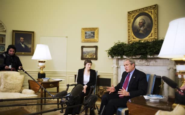 US President George W. Bush (R) speaks to the press during a meeting with New Zealand Prime Minister Helen Clark 21 March 2007 in the Oval Office.