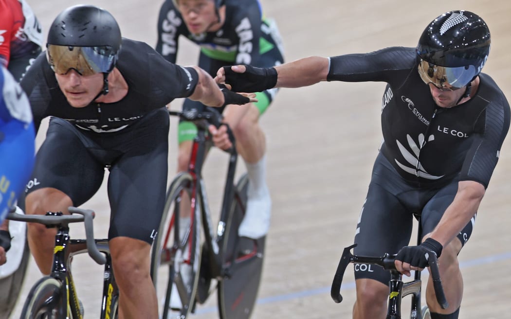 Campbell Stewart (L) and Tom Sexton contest the men's Madison at the Oceania track cycling championships in Brisbane.