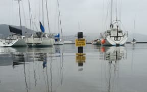 Slippery when wet sign under water