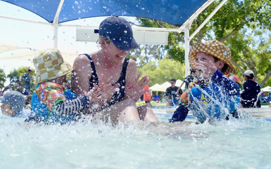 Daniela Alderdice and her two boys Charlie and Otis enjoy the water.