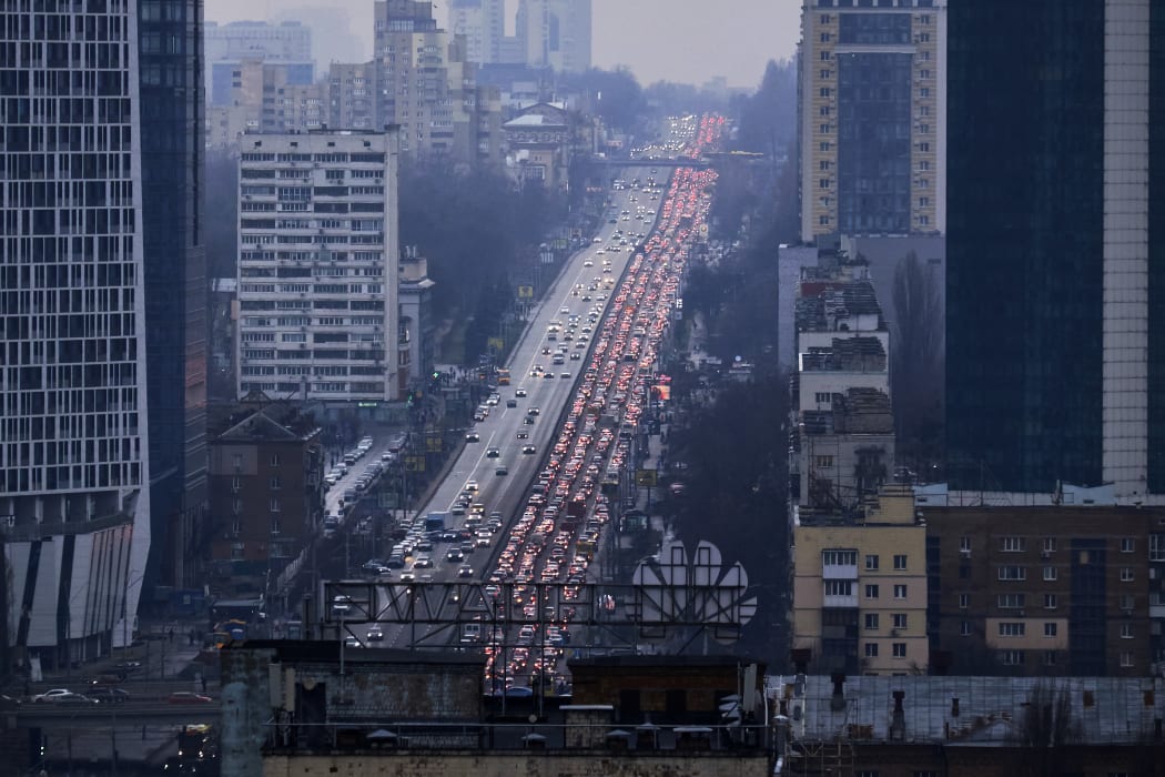Inhabitants of Kyiv leave the city following pre-offensive missile strikes of the Russian armed forces and Belarus on February 24, 2022 in Kyiv, Ukraine.