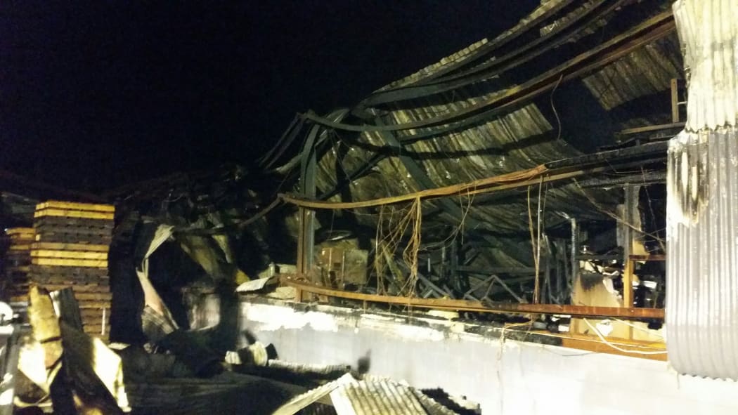 The charred exterior of the Total Plastics factory building in Henderson.