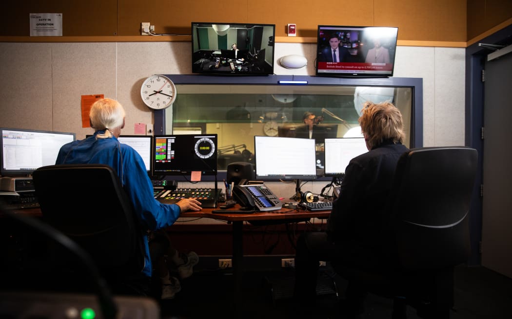 A news studio, seen from behind.