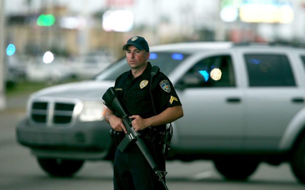 Police patrol Airline Highway near the scene of the shooting of three police officers, 17 July  2016.