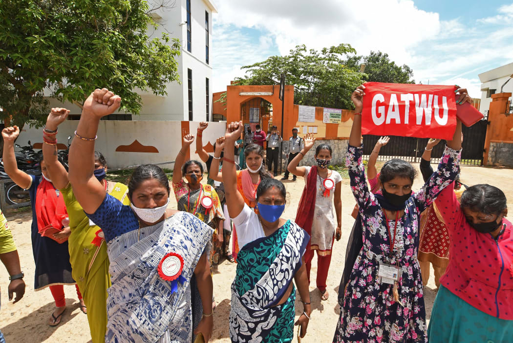 Workers from the Euro Clothing Company II protest in front of the factory, which was closed due to brands cancelling their orders amid Covid-19 coronavirus pandemic, in Karnataka, India.