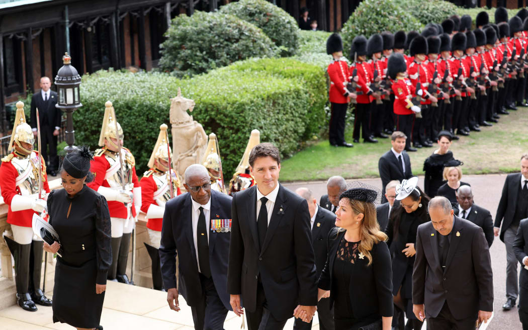 Canada's Prime Minister Justin Trudeau, his wife Sophie Gregoire Trudeau and other guests arrive at St George's Chapel inside Windsor Castle on September 20, 2022, ahead of the Committal Service for Queen Elizabeth II.