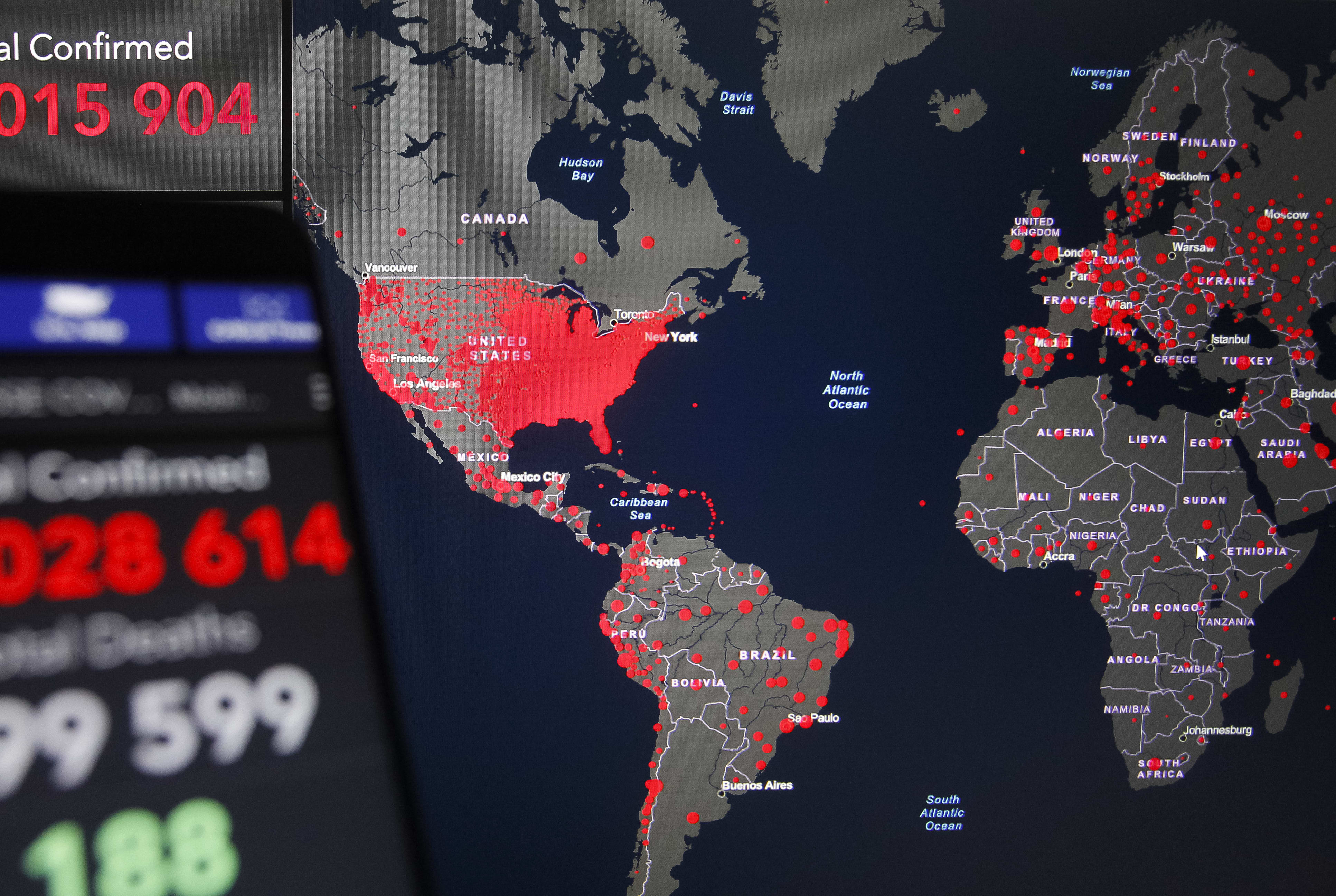 A world map of the COVID-19 coronavirus cases by the Center for Systems Science and Engineering at Johns Hopkins University is seen on 28 June, 2020.
