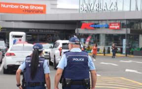 Police officers outside Hawke's Bay shops during operation to deter shoplifters