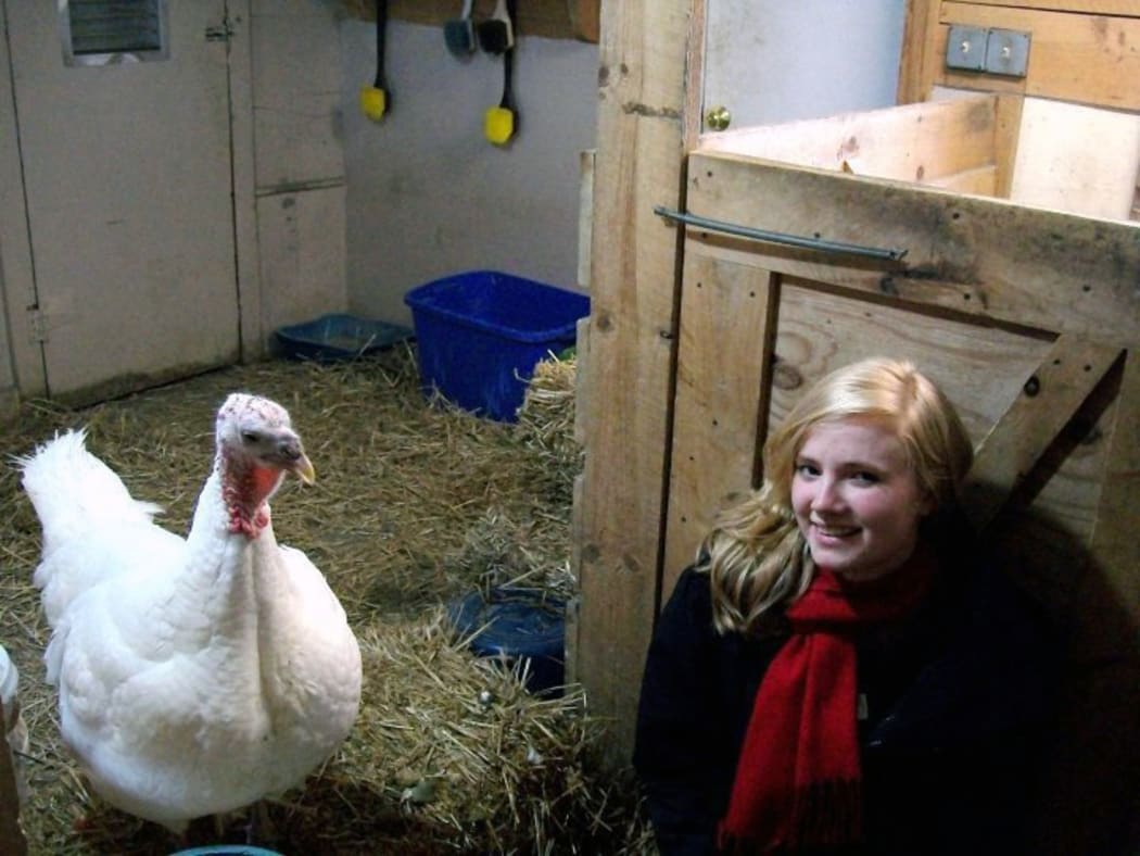 A photo of New Zealand Animal Law Association president Danielle Duffield, 25, with a turkey