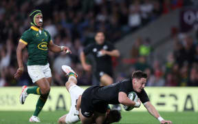 Cam Roigard scores a try against South Africa.