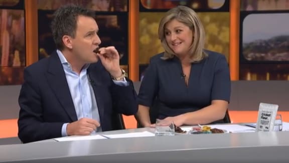 Mike Hosking eats a tarantula on Seven Sharp.