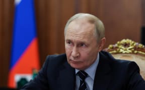 In this pool photograph distributed by the Russian state agency Sputnik, Russia's President Vladimir Putin looks on as he meets Russia's Deputy Prime Minister in Moscow on September 30, 2025. (Photo by Alexander KAZAKOV / POOL / AFP)