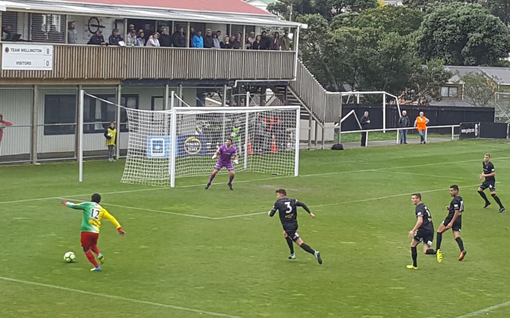 Toti's Mathew David makes a rare foray into Team Wellington's box.