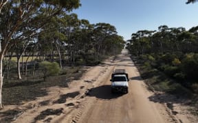 Piripi driving across the Outback