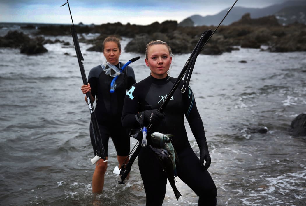 Linda Mathias and Holly Morchat bring in their catch