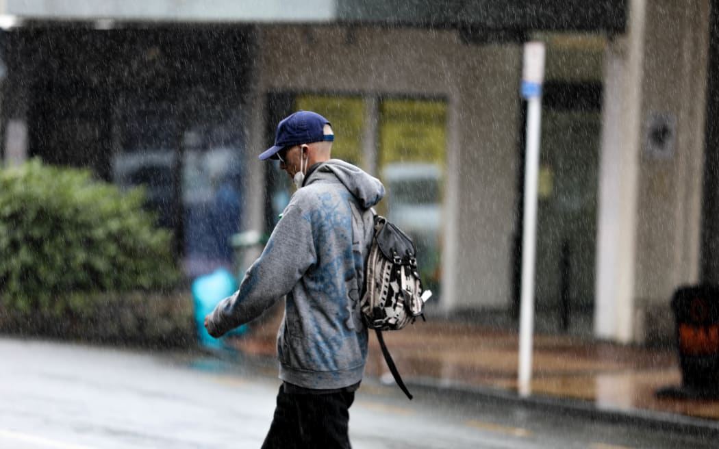 A man walks in the streets of Whangarei.