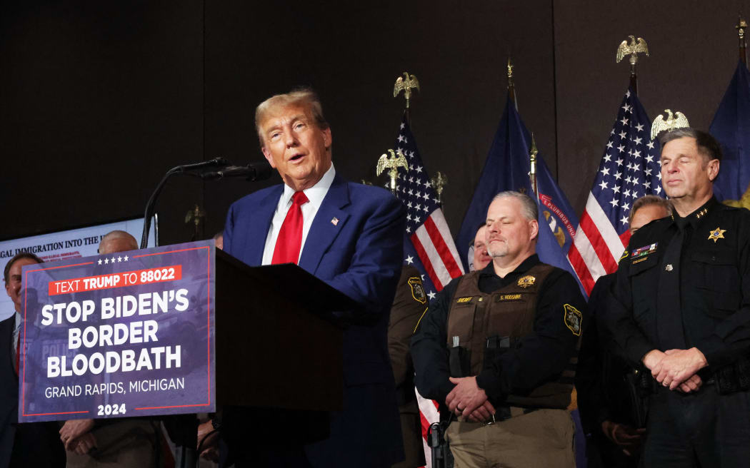 GRAND RAPIDS, MICHIGAN - APRIL 02: Former U.S. President Donald Trump speaks at a campaign event on April 02, 2024 in Grand Rapids, Michigan. Trump delivered a speech which his campaign has called "Biden's Border Bloodbath", as recent polls have shown that immigration and the situation at the U.S. Southern border continue to be top issues on voters' minds going into the November election.   Spencer Platt/Getty Images/AFP (Photo by SPENCER PLATT / GETTY IMAGES NORTH AMERICA / Getty Images via AFP)