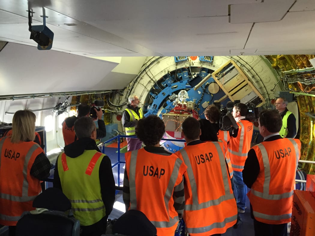 Representatives of New Zealand media onboard SOFIA during a tour.