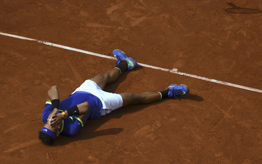 Spain's Rafael Nadal celebrates after defeating Switzerland's Stanislas Wawrinka during the men's final tennis match at the Roland Garros 2017 French Open. June 11, 2017.