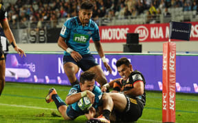 Harry Plummer scores a try for the Blues.
in a Super Rugby game at Eden Park.