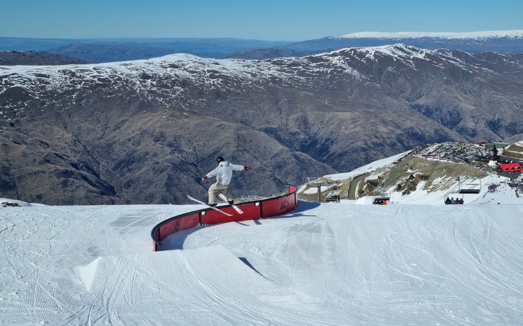 A skiier carves up the slopes at Cardrona Alpine Resort.