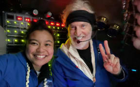 Inside the submersible Limiting Factor close to the ocean floor, Nicole Yamase and pilot/owner Victor Vescovo