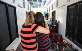 Refugee Pari, right, and her mother