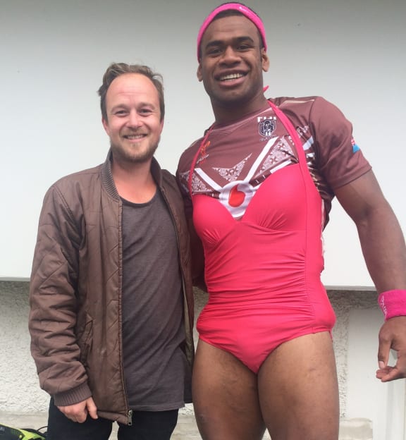Mikaele Ravalawa of Fiji sporting the team's 'pink dress', reserved as punishment for misdeeds in camp.