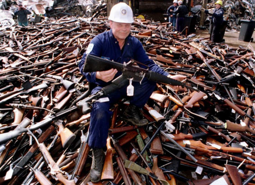 Norm Legg, a project supervisor with a local security firm, holds up an armalite rifle which is similar to the one used in the Port Arthur massacre and has been handed in for scrap 08 September in Melbourne.