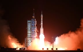A Long March-2F carrier rocket, carrying the Shenzhou-15 spacecraft with three astronauts to China's Tiangong space station, lifts off from the Jiuquan Satellite Launch Center in Northwest China’s Gansu Province late on 29 November 2022. - China launched the Shenzhou-15 spacecraft on November 29, 2022 carrying three astronauts to its space station, where they will complete the country's first-ever crew handover in orbit, state news agency Xinhua reported.