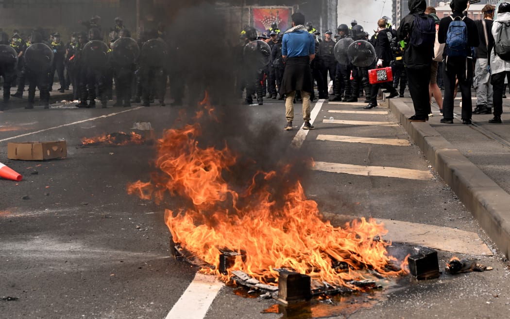 Protesters confront police outside the Land Forces 2024 arms fair in Melbourne on September 11, 2024. (Photo by William WEST / AFP)