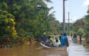 Waivou Village in Rewa Province, Fiji was flooded for a week during floods in December 2016. A Fiji Red Cross team is seen here helping to assess the village's needs.